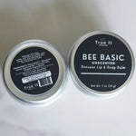 Load image into Gallery viewer, Two tins of True It Naturals Bee Basic Unscented Beeswax Lip &amp; Body Balm on a white background showing front and back labels.
