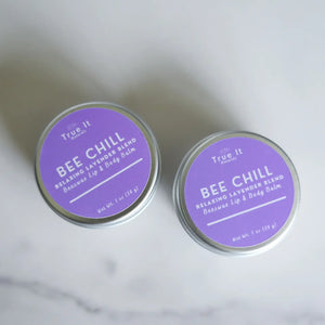 Two tins of True It Naturals Bee Chill Beeswax Lip Balm on a white background