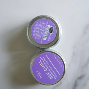 Two containers of True It Naturals Bee Chill beeswax lip balm. Showing the front and back labels.