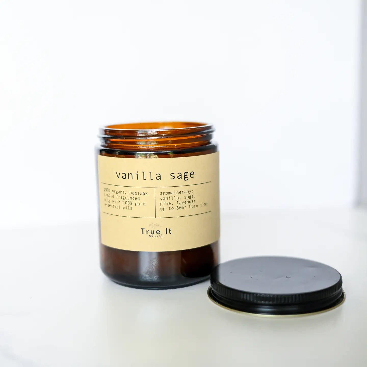 A True It Naturals Beeswax Candle - Vanilla Sage with the lid off.