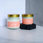 Load image into Gallery viewer, 2oz small citrus cream body butter raised up next to the large 4oz citrus cream body butter

