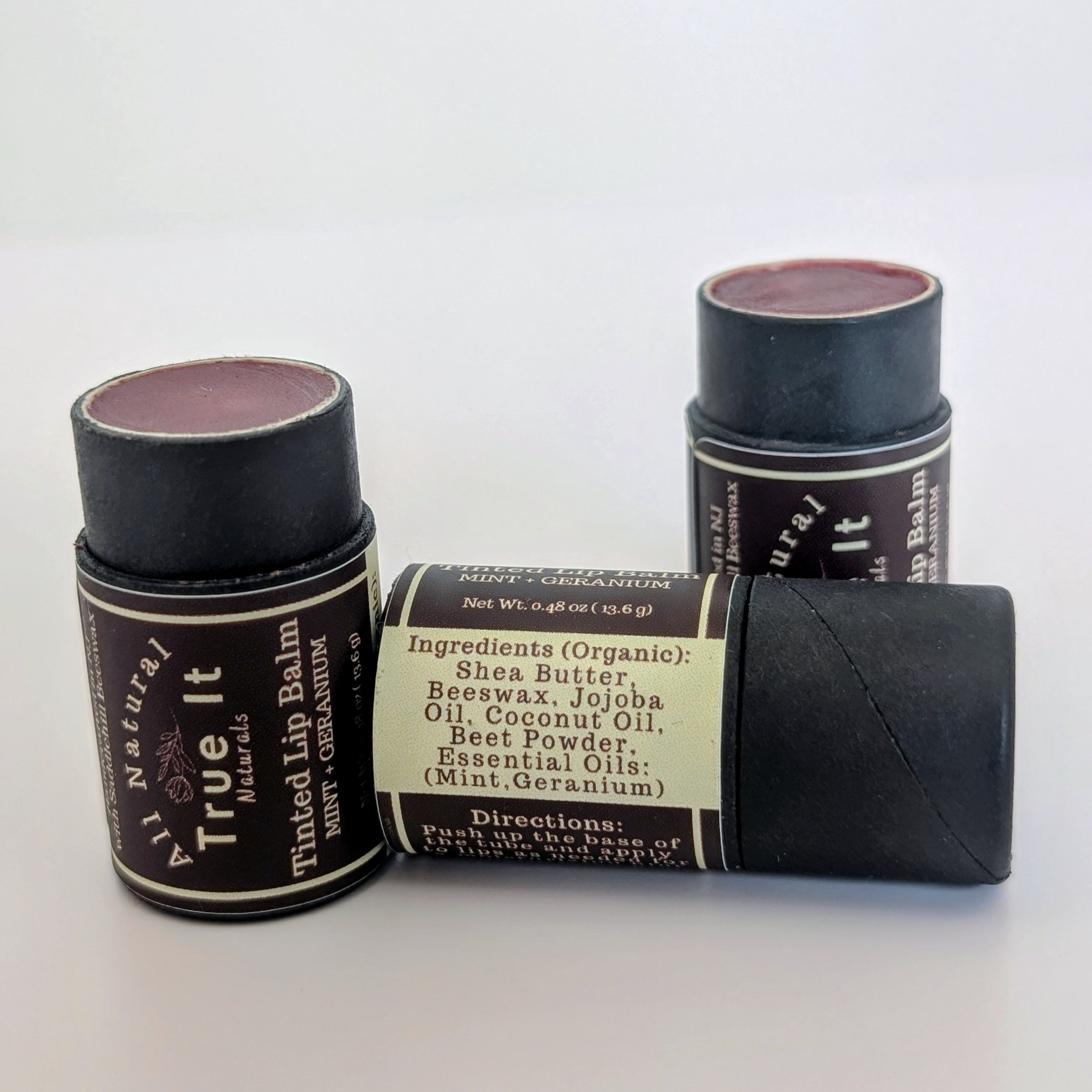 True It Naturals Tinted Lip Balm showing the natural tint and ingredients listed.